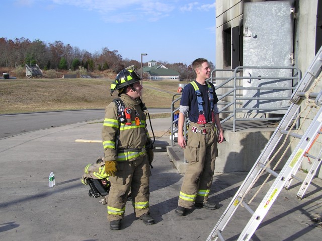 Firefighters Mike Whitt and Pat Main attend RIT training at the South Kingstown burn building 11/11/06.